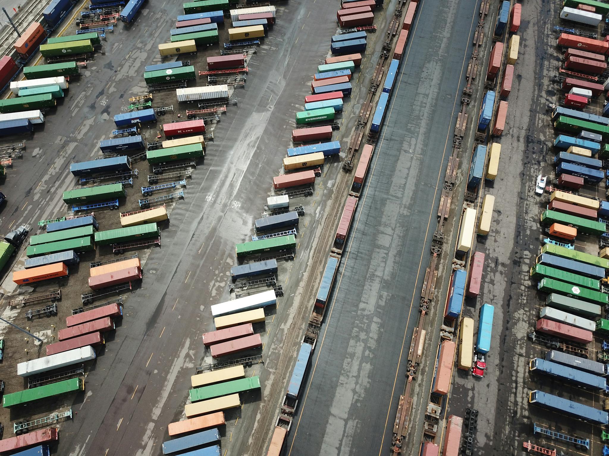 Aerial photograph of organized colorful shipping containers in a Denver cargo yard.